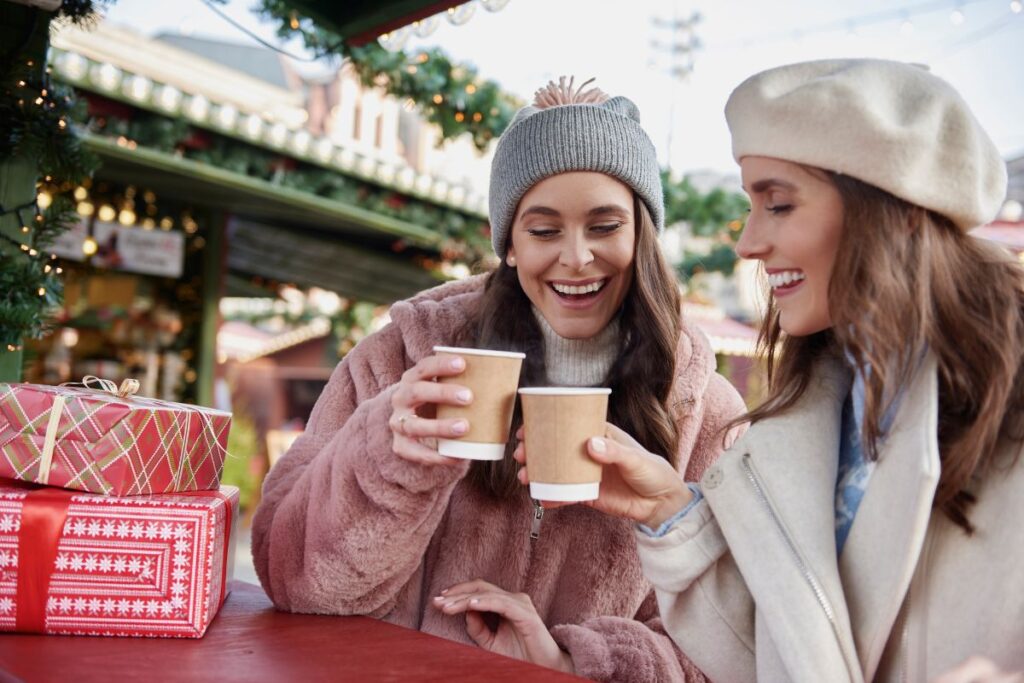 2 ladies drinking coffee at Christmas